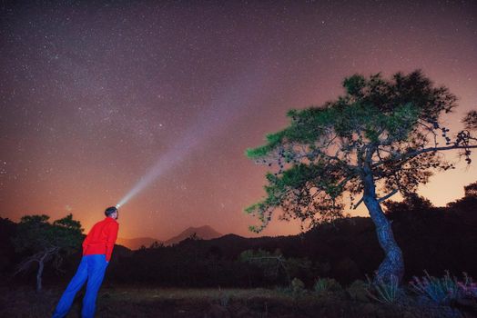person who is looking at the starry sky.