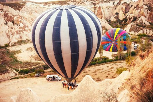 Cappadocia, Turkey. The first crew of flame and heat for inflating the balloon before launch. Balloon is one of the most famous of that trip will have to do in Cappadocia