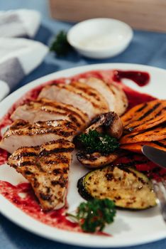 Grilled vegetables and chicken fillet. Traditional cuisine. Grill kitchen.