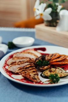 Grilled vegetables and chicken fillet. Traditional cuisine. Grill kitchen.