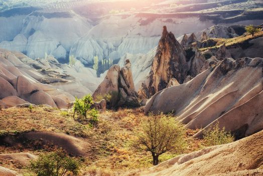 Fantastic sunrise over the Red Valley in Cappadocia, Anatolia, Turkey. Volcanic mountains in Goreme National Park.
