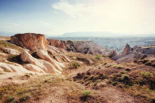 Beauty geological formations in Cappadocia, Turkey. Cappadocia with its valley, ravine, hills, located between the volcanic mountains in Goreme National Park.
