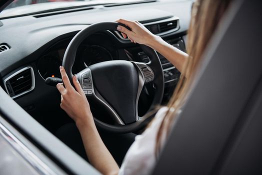 Portrait of a young beautiful woman. Female driving car
