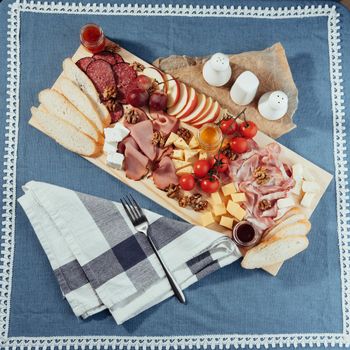 big group of meat, bread and vegetables.