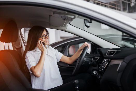Businesswoman talking on the phone in the car