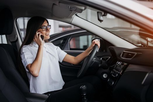 Businesswoman talking on the phone in the car