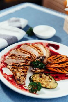 Grilled vegetables and chicken fillet. Traditional cuisine. Grill kitchen.