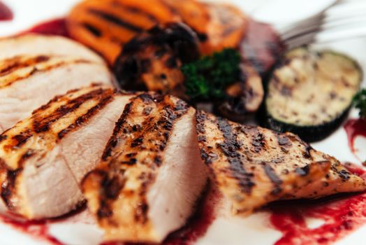 Grilled vegetables and chicken fillet. Traditional cuisine. Grill kitchen.