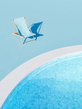 3D rendering of blue lounger placed near outdoor swimming pool with transparent rippling water on sunny day in summer