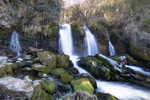 Beautiful landscape showing some waterfalls and some rocks in a forest. The place is called La Dou del Bastareny and it is located in Bagà in Catalonia