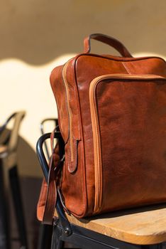 Orange leather backpack. Street photo.