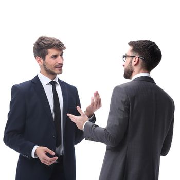 in full growth. two young businessmen discussing something. isolated on white background