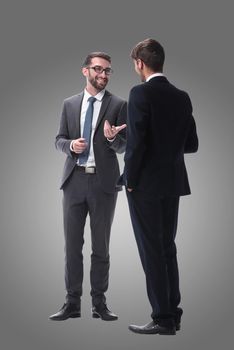 in full growth. business partners are discussing something. isolated on white background