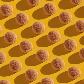 Sweet candies pattern on a yellow top view