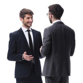 in full growth. two young businessmen discussing something. isolated on white background
