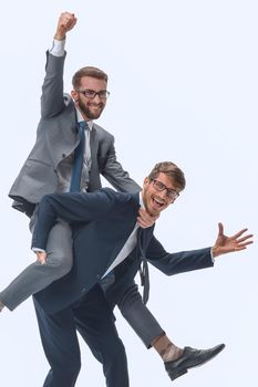 happy businessman carrying his colleague on the piggyback . isolated on white background