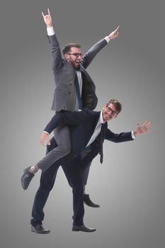 happy businessman carrying his colleague on the piggyback . isolated on white background