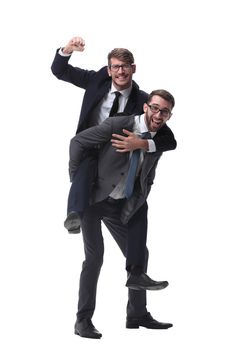 smiling businessman sitting on the back of his colleague . isolated on white background.