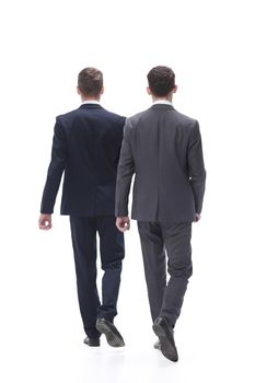 rear view. two businessmen confidently stepping forward. isolated on white background