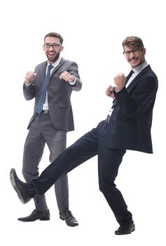 in full growth. two happy dancing young businessmen . isolated on white background.