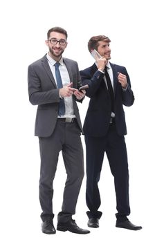 full length . two businessmen using their smartphones . isolated on white background