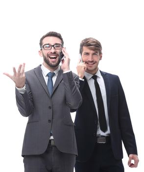 full length . two businessmen using their smartphones . isolated on white background