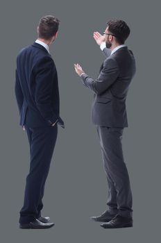 rear view. two businessmen looking at copy space. isolated on white background.