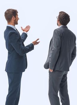 rear view. two businessmen looking at copy space. isolated on white background.