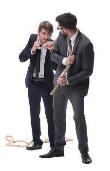 full length . two businessmen pulling a long rope. isolated on white background.