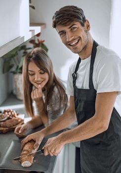 modern young couple having fun making sandwiches for Breakfast.
