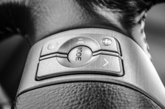 Car audio control buttons.