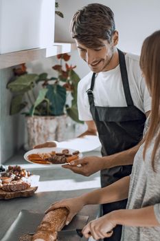 close up.young husband and wife cook Breakfast together