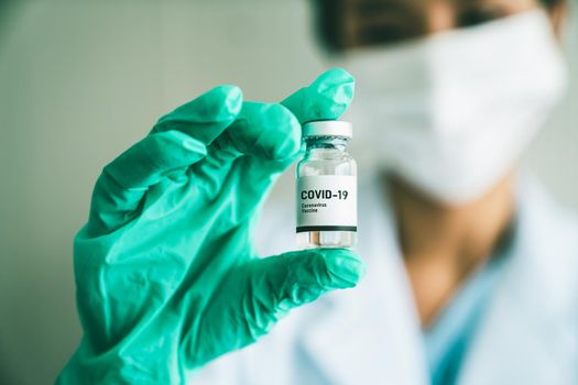 Skillful doctor prepare vaccine proficiently before injection . Covid 19 and coronavirus vaccination center service concept .