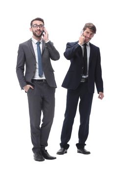 full length . two businessmen using their smartphones . isolated on white background