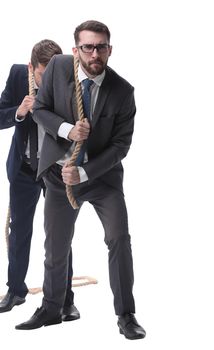 full length . two businessmen pulling a long rope. isolated on white background.