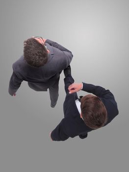 top view. two business people stepping forward. isolated on white background