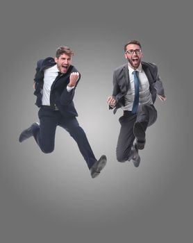 in full growth. two cheerful dancing business people. isolated on white background.