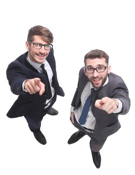 top view . two smiling businessmen looking at the camera . isolated on white background