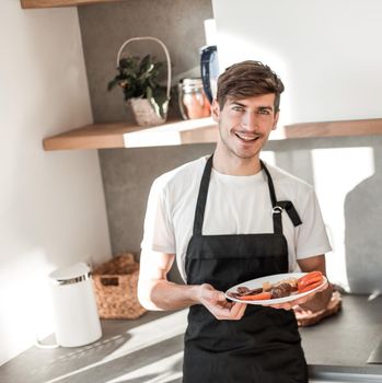 attractive young man with Breakfast for his girlfriend . photo with copy space