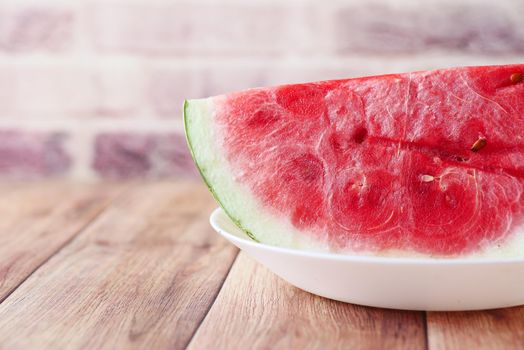 close up of slice of water melon on white background