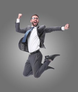 in full growth. happy young businessman. isolated on white background.