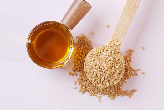 coking oil and seeds in a container on table .