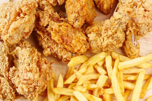 junk foods on plate on wooden table close up ,