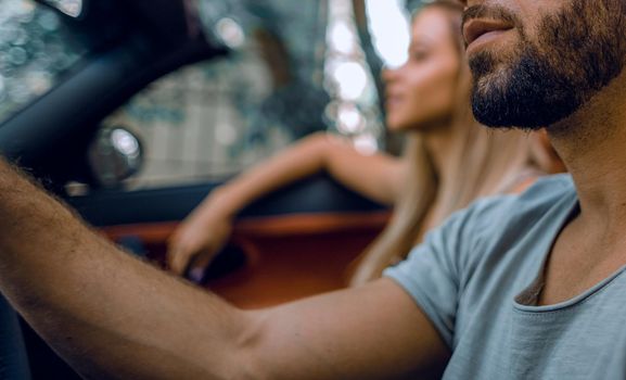 close up.a handsome man driving a luxury car.the concept of lifestyle