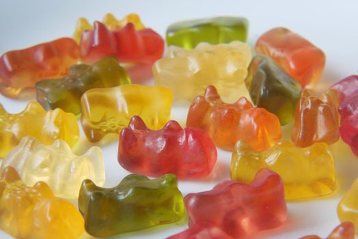 gummy candies on a plate on yellow background