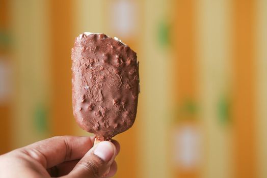 young men eating chocolate flavor ice ,
