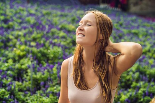 Young woman on lavender field. Lavender farm concept.