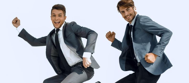 Successful two businessman in suit.they are happy and jumping on isolated background. Business concept, Lifestyle concept