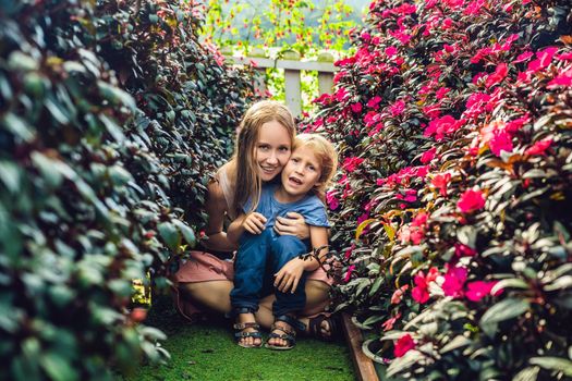 Mum and the son of a flower greenhouse.