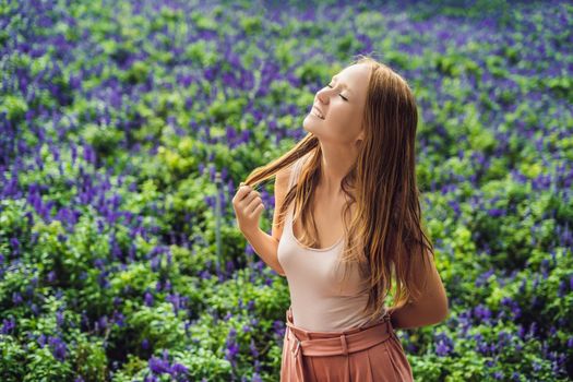 Young woman on lavender field. Lavender farm concept.